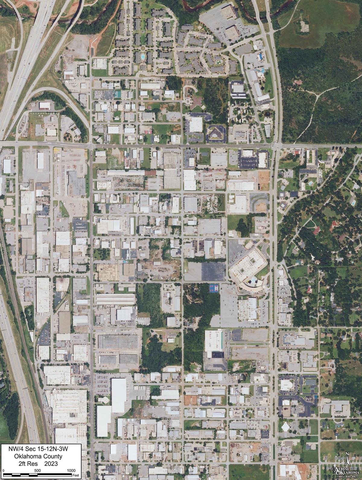 2023: warehouses, the interchange, and the creek's tree line still where it was in 1941