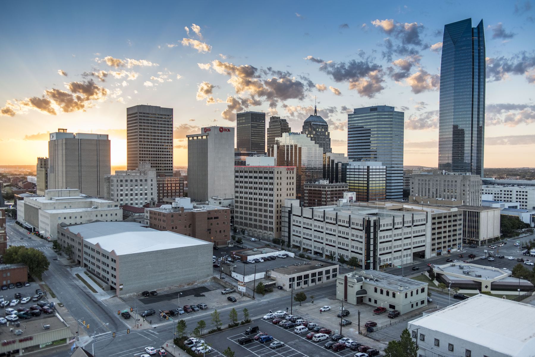Downtown Oklahoma City at golden hour, close helicopter oblique